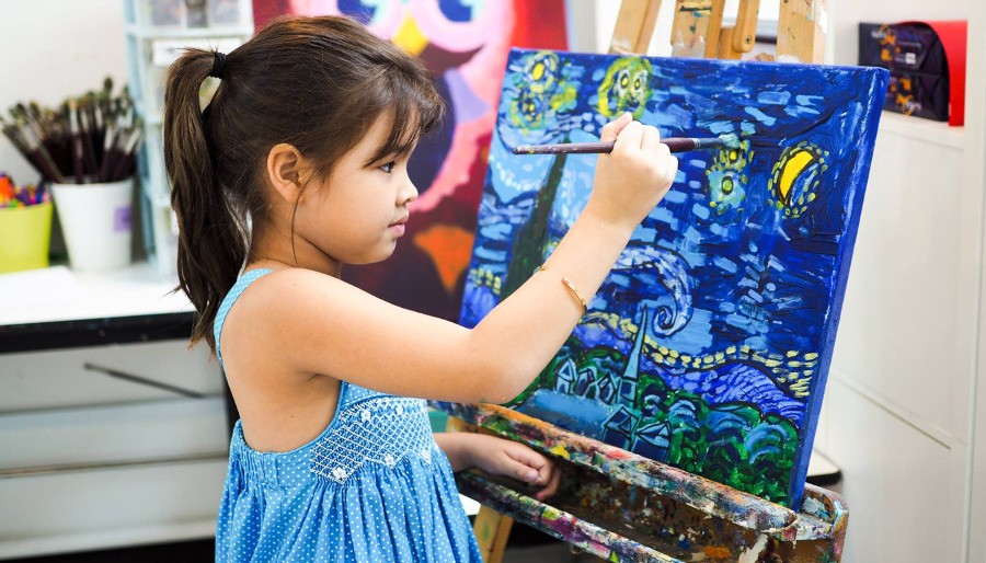 Very talented girl painting a picture